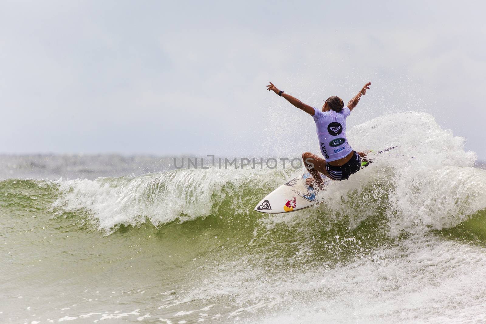 SNAPPER ROCKS, GOLD COAST, AUSTRALIA - 9 MARCH: Unidentified Surfer races the Quiksilver & Roxy Pro World Title Event. 9 March 2013, Snapper Rocks, Gold Coast, Australia