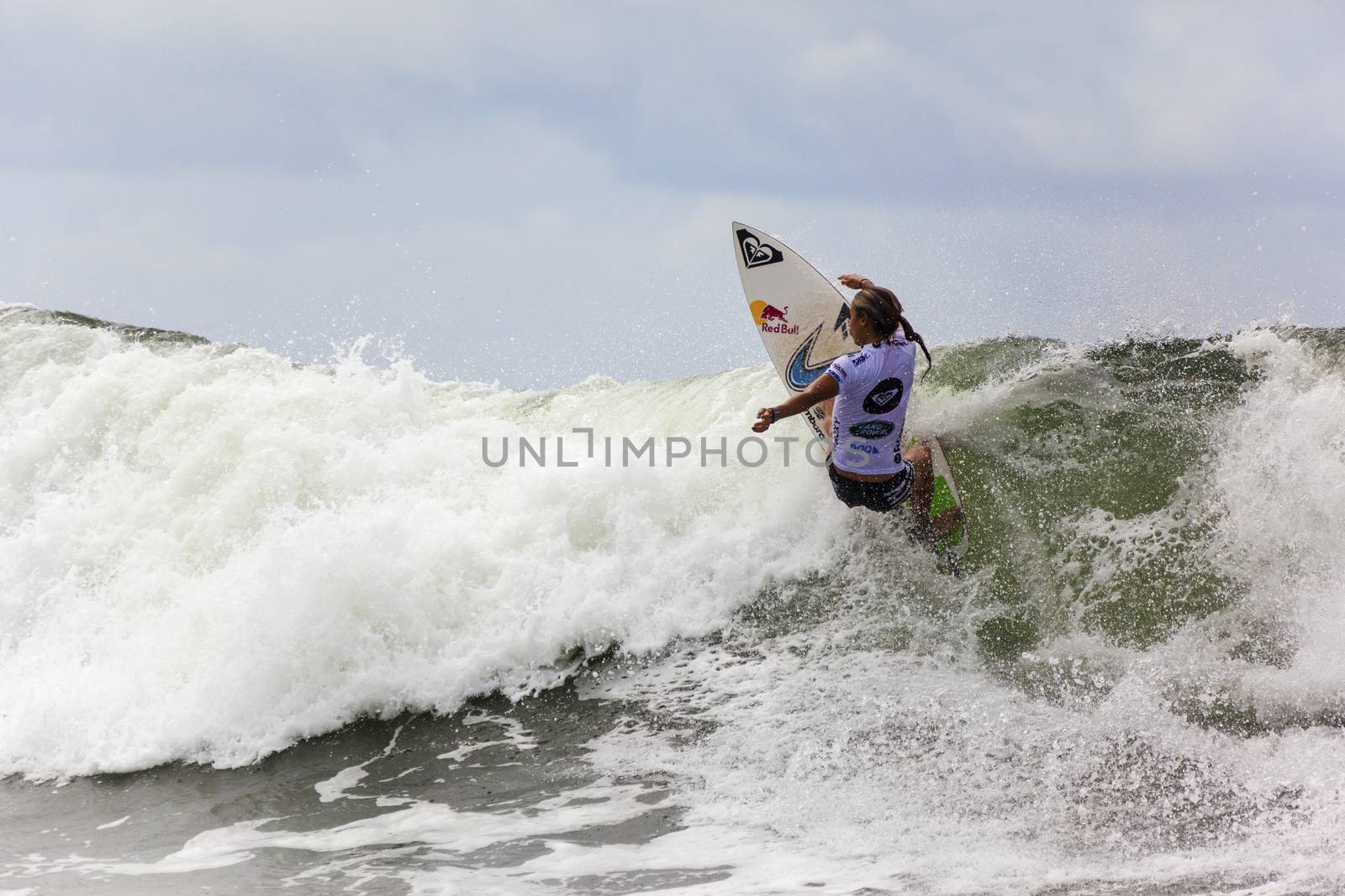 SNAPPER ROCKS, GOLD COAST, AUSTRALIA - 9 MARCH: Unidentified Surfer races the Quiksilver & Roxy Pro World Title Event. 9 March 2013, Snapper Rocks, Gold Coast, Australia