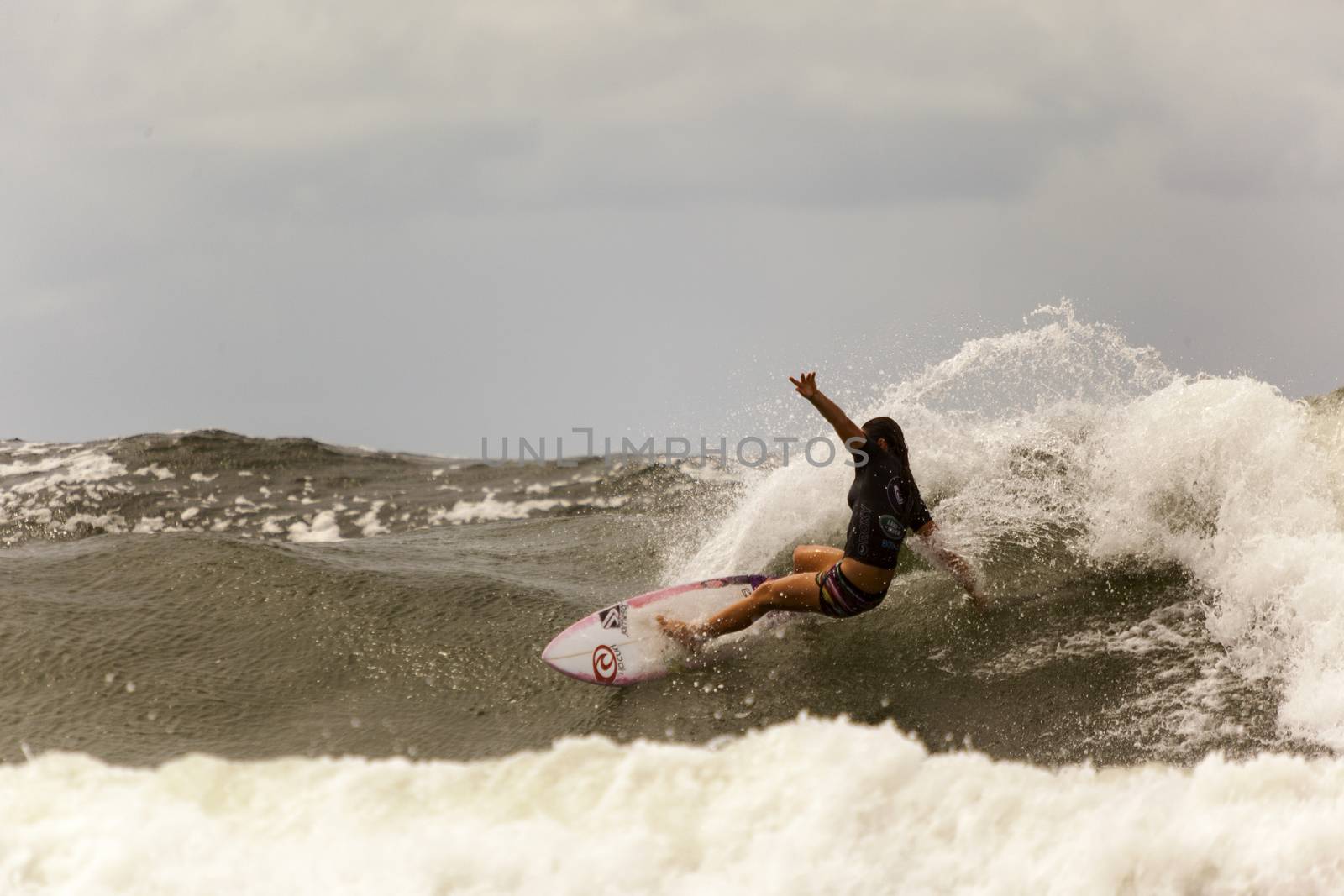 SNAPPER ROCKS, GOLD COAST, AUSTRALIA - 9 MARCH: Unidentified Surfer races the Quiksilver & Roxy Pro World Title Event. 9 March 2013, Snapper Rocks, Gold Coast, Australia