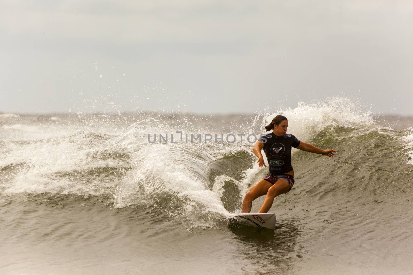 SNAPPER ROCKS, GOLD COAST, AUSTRALIA - 9 MARCH: Unidentified Surfer races the Quiksilver & Roxy Pro World Title Event. 9 March 2013, Snapper Rocks, Gold Coast, Australia