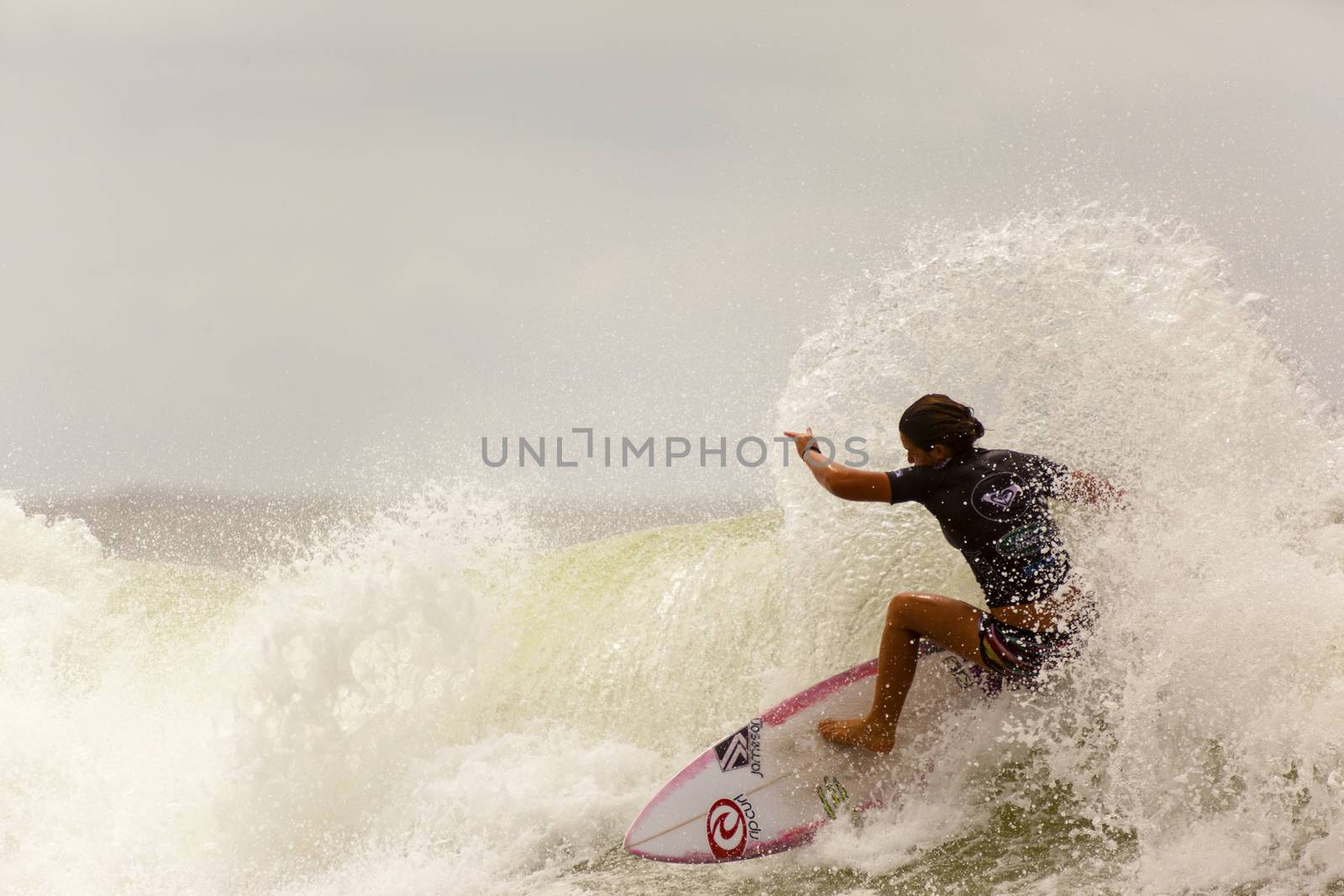 SNAPPER ROCKS, GOLD COAST, AUSTRALIA - 9 MARCH: Unidentified Surfer races the Quiksilver & Roxy Pro World Title Event. 9 March 2013, Snapper Rocks, Gold Coast, Australia