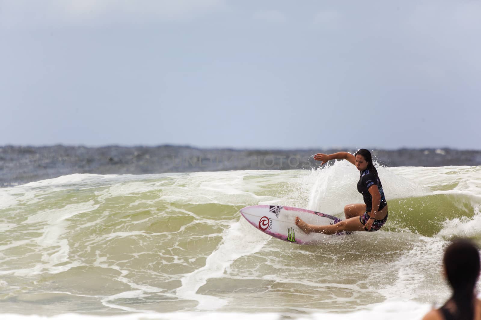 SNAPPER ROCKS, GOLD COAST, AUSTRALIA - 9 MARCH: Unidentified Surfer races the Quiksilver & Roxy Pro World Title Event. 9 March 2013, Snapper Rocks, Gold Coast, Australia