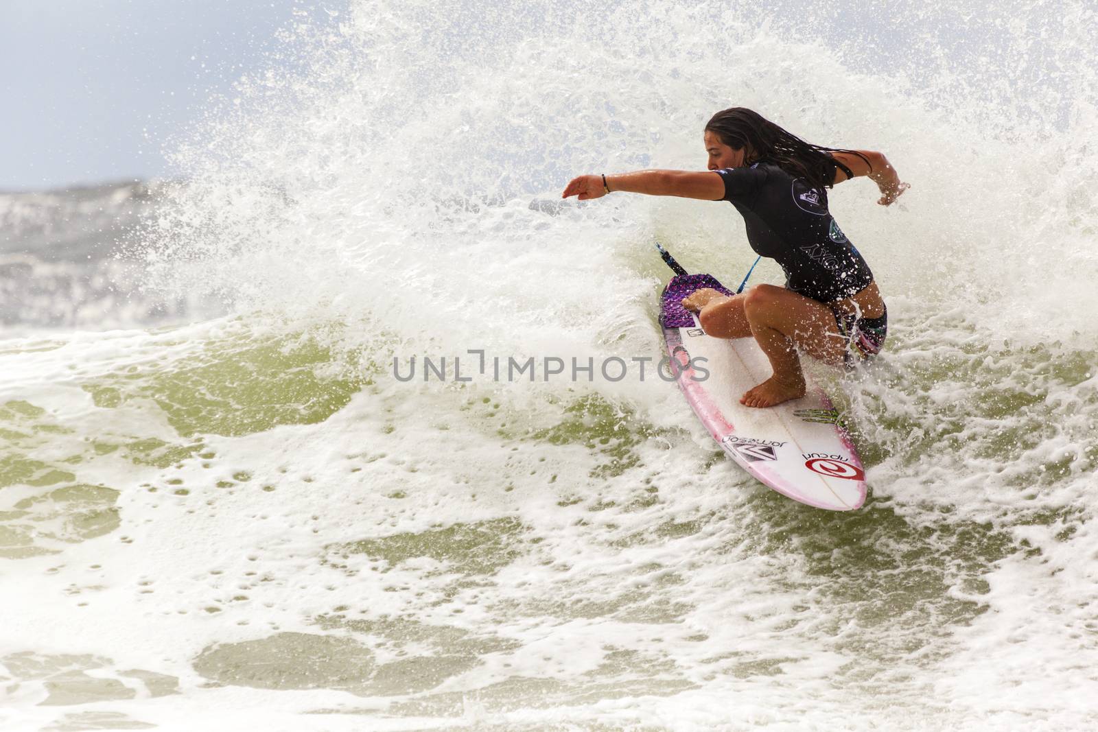 SNAPPER ROCKS, GOLD COAST, AUSTRALIA - 9 MARCH: Unidentified Surfer races the Quiksilver & Roxy Pro World Title Event. 9 March 2013, Snapper Rocks, Gold Coast, Australia