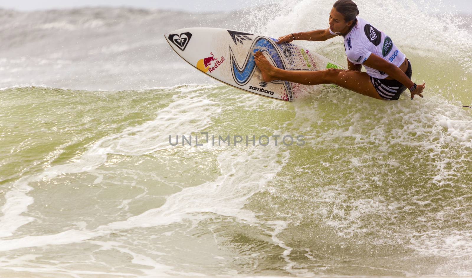 SNAPPER ROCKS, GOLD COAST, AUSTRALIA - 9 MARCH: Unidentified Surfer races the Quiksilver & Roxy Pro World Title Event. 9 March 2013, Snapper Rocks, Gold Coast, Australia