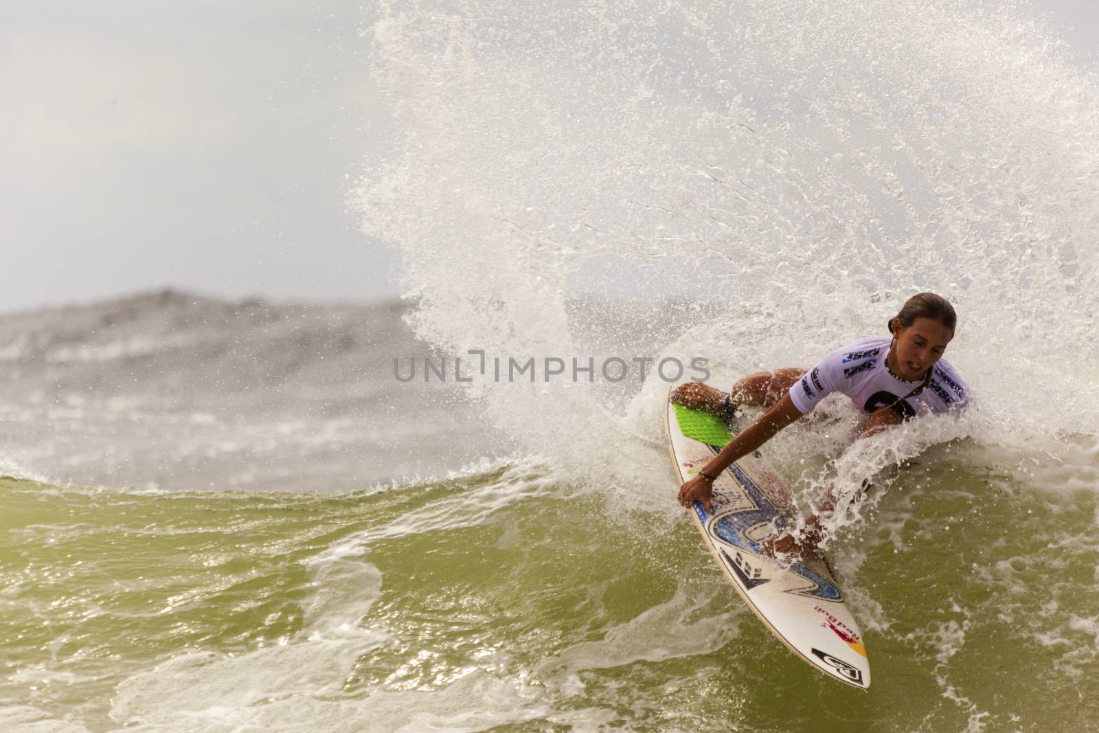 SNAPPER ROCKS, GOLD COAST, AUSTRALIA - 9 MARCH: Unidentified Surfer races the Quiksilver & Roxy Pro World Title Event. 9 March 2013, Snapper Rocks, Gold Coast, Australia