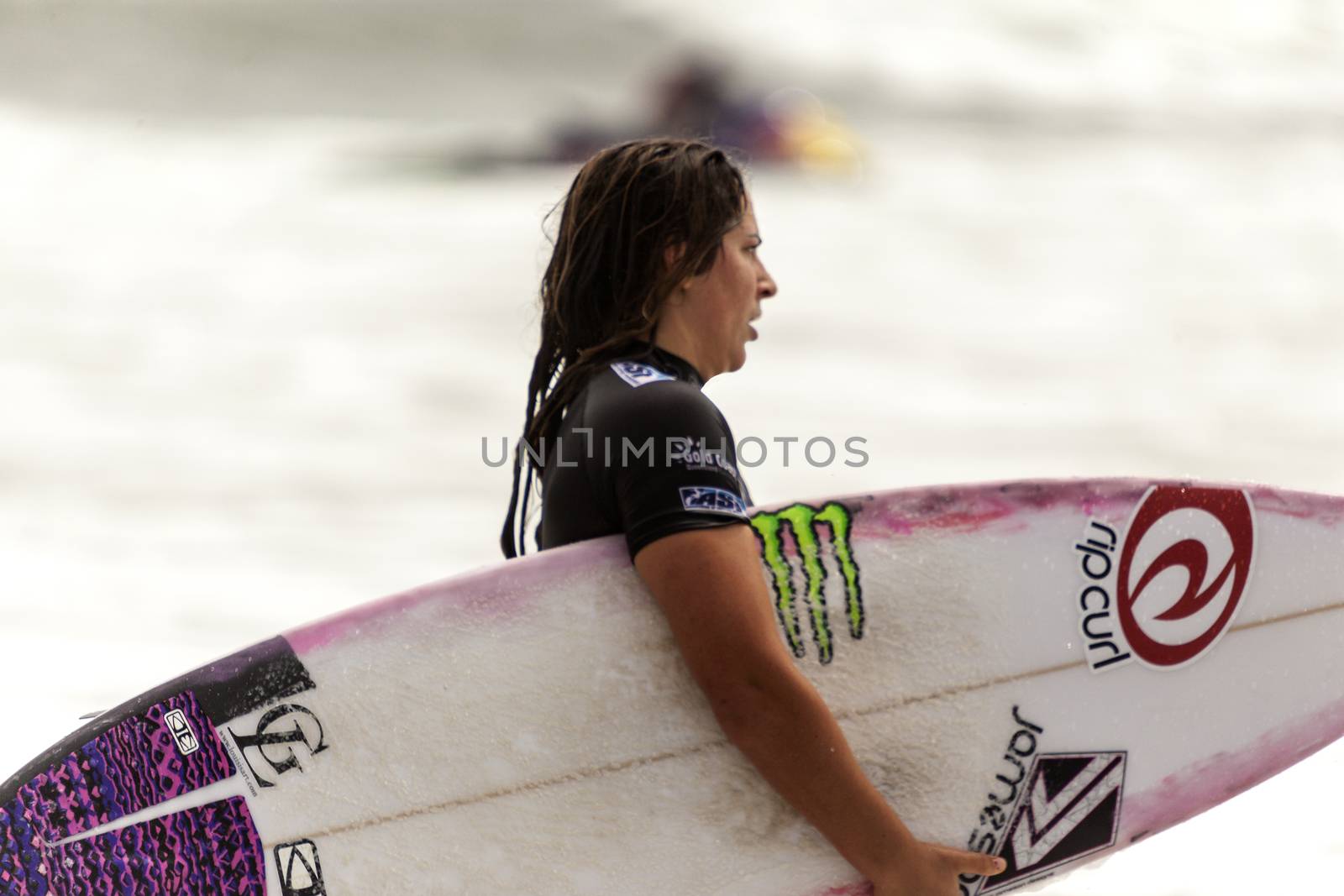 SNAPPER ROCKS, GOLD COAST, AUSTRALIA - 9 MARCH: Unidentified Surfer races the Quiksilver & Roxy Pro World Title Event. 9 March 2013, Snapper Rocks, Gold Coast, Australia