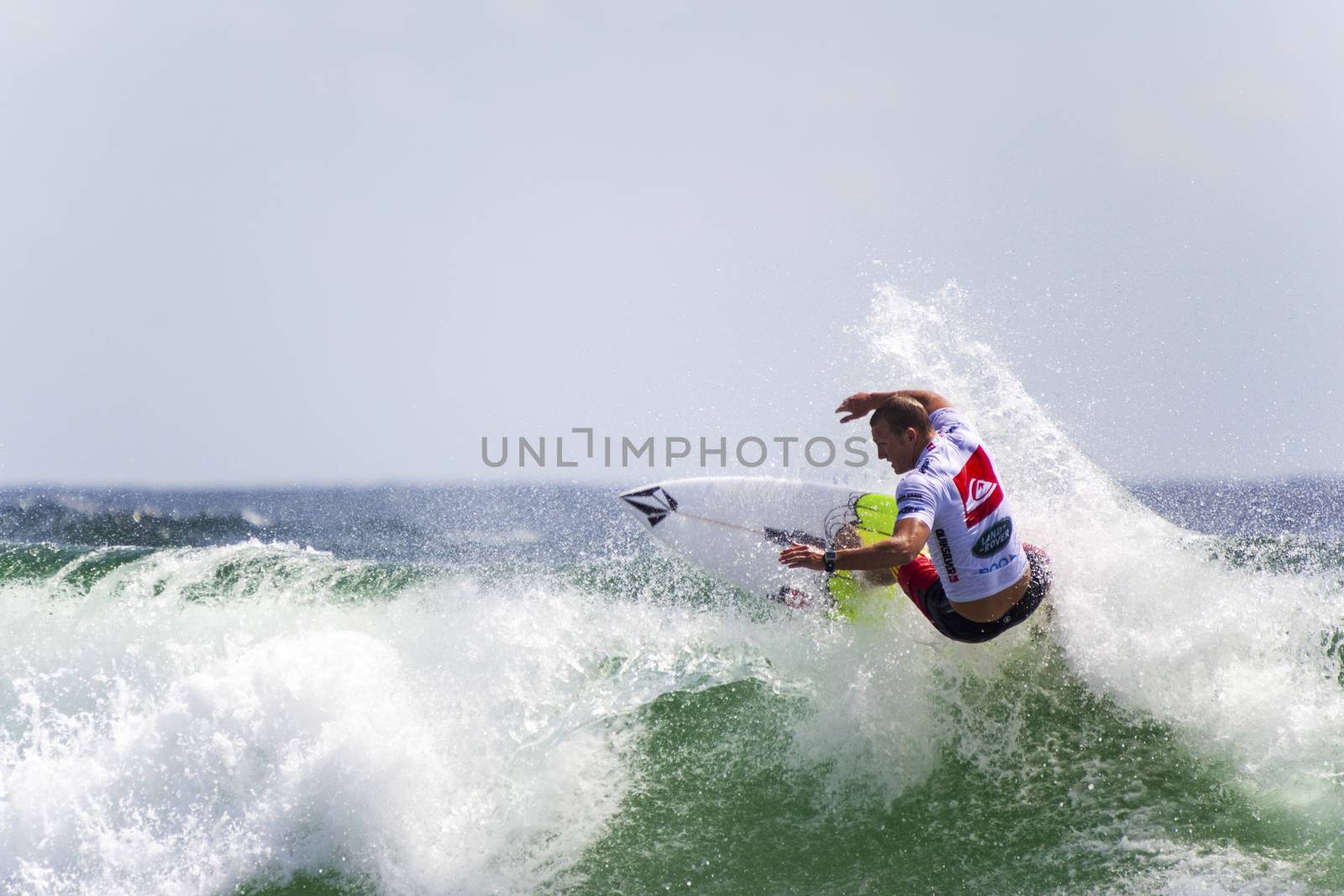 SNAPPER ROCKS, GOLD COAST, AUSTRALIA - 9 MARCH: Unidentified Surfer races the Quiksilver & Roxy Pro World Title Event. 9 March 2013, Snapper Rocks, Gold Coast, Australia