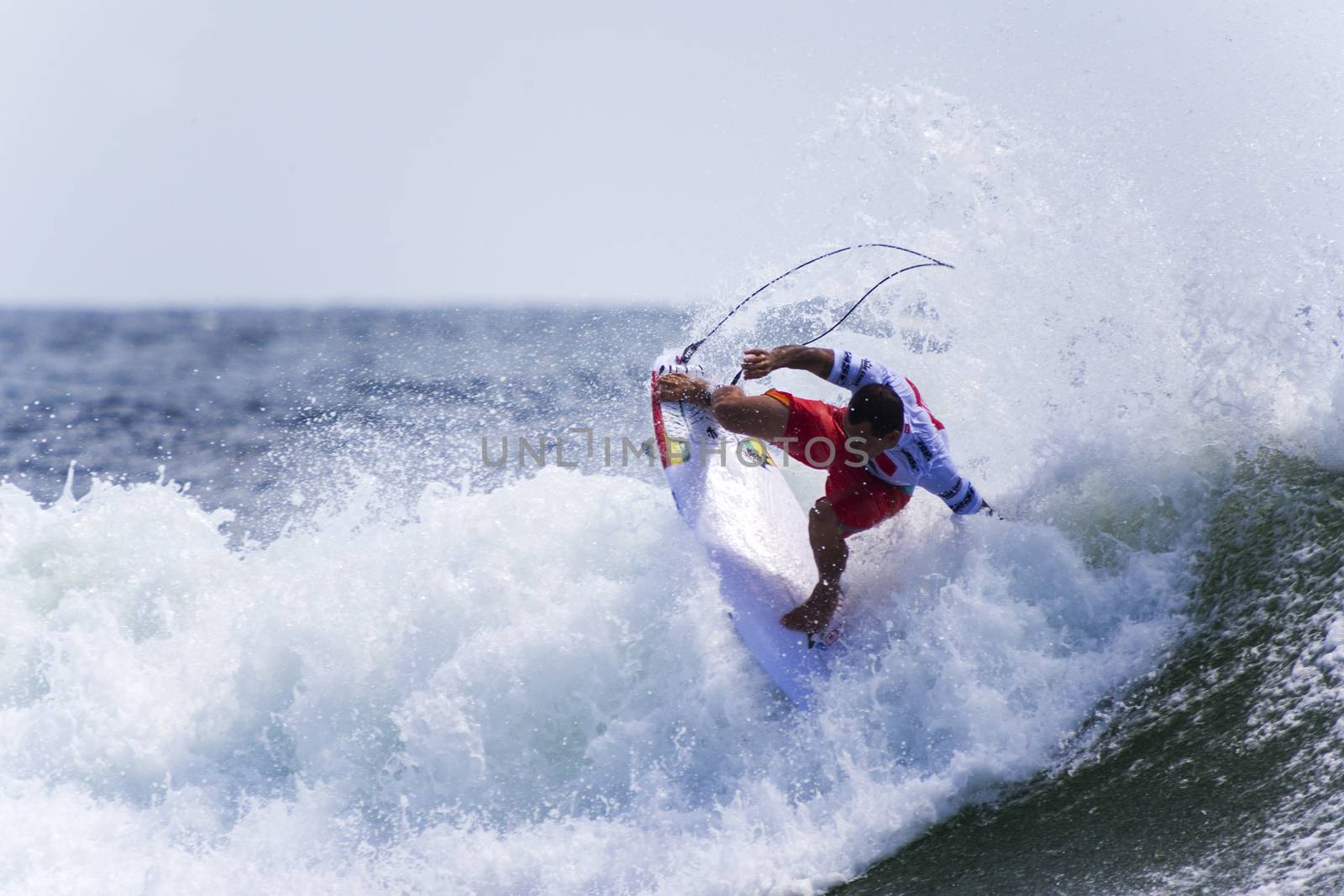 SNAPPER ROCKS, GOLD COAST, AUSTRALIA - 9 MARCH: Unidentified Surfer races the Quiksilver & Roxy Pro World Title Event. 9 March 2013, Snapper Rocks, Gold Coast, Australia