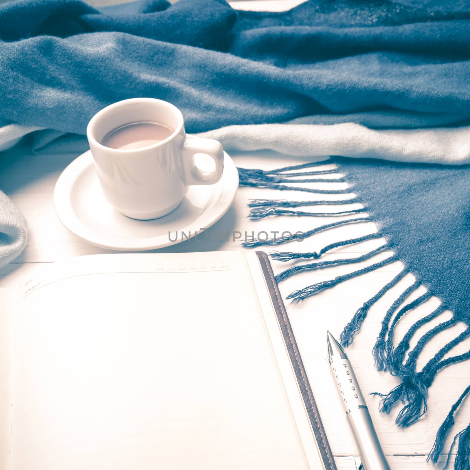 coffee and scarf background on white table vintage style