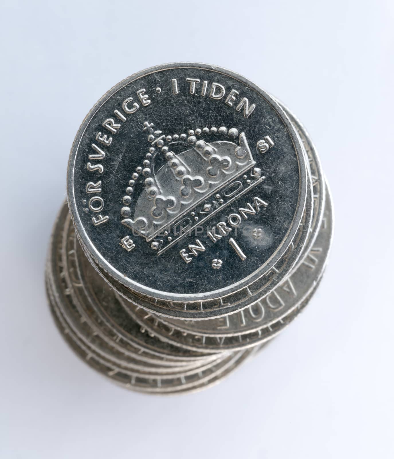 Swedish One Coins Stacked with a white background close up macro image.