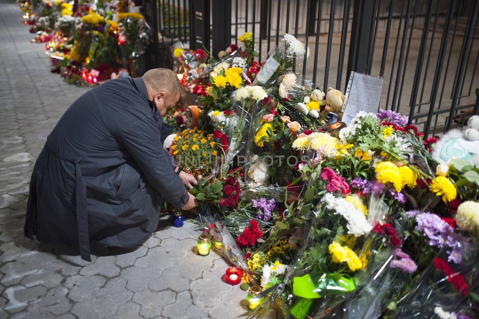 UKRAINE, Kiev: A man puts flowers outside the Russian embassy in Kiev, Ukraine, to pay tribute to the victims of crashed Russian Metrojet plane in Egypt, on November 1, 2015. The Airbus, with 224 people on board, crashed in a mountainous part of Egypt's Sinai Peninsula on October 31, 2015