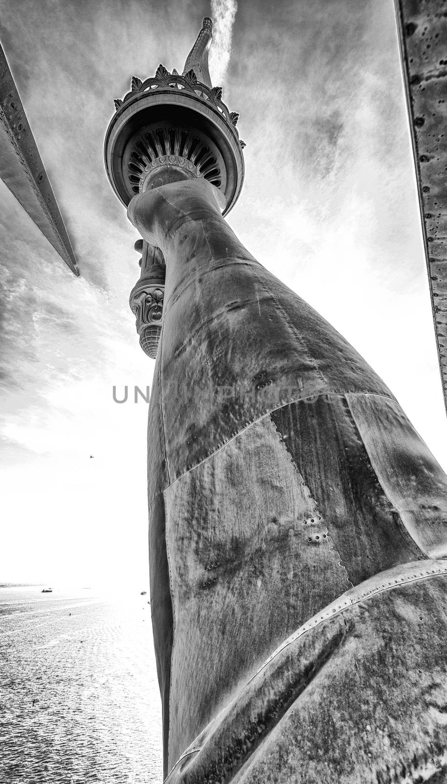 Black and white view of Statue of Liberty arm and flame from the by jovannig