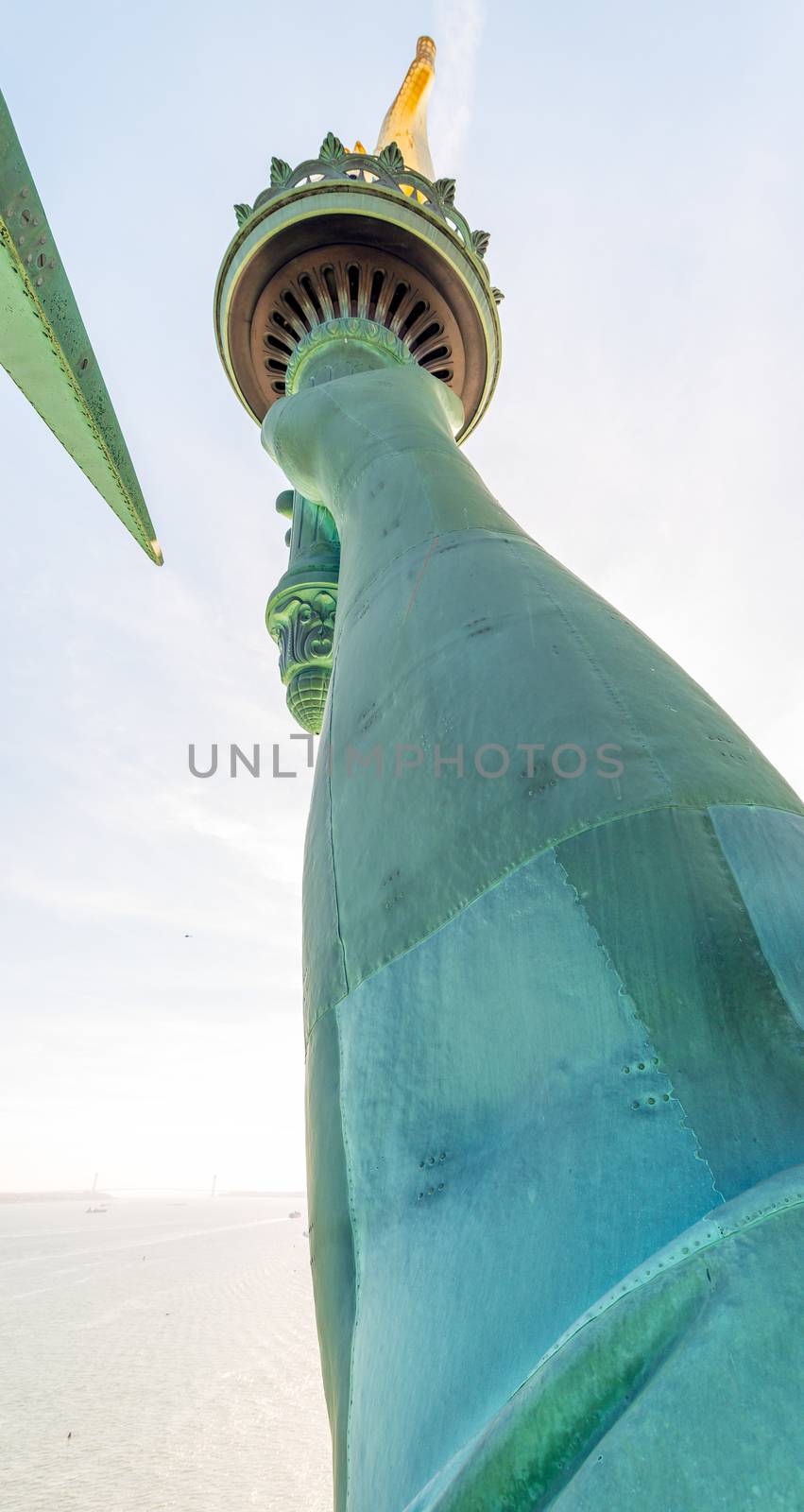 Statue of Liberty arm and flame, wide angle view by jovannig