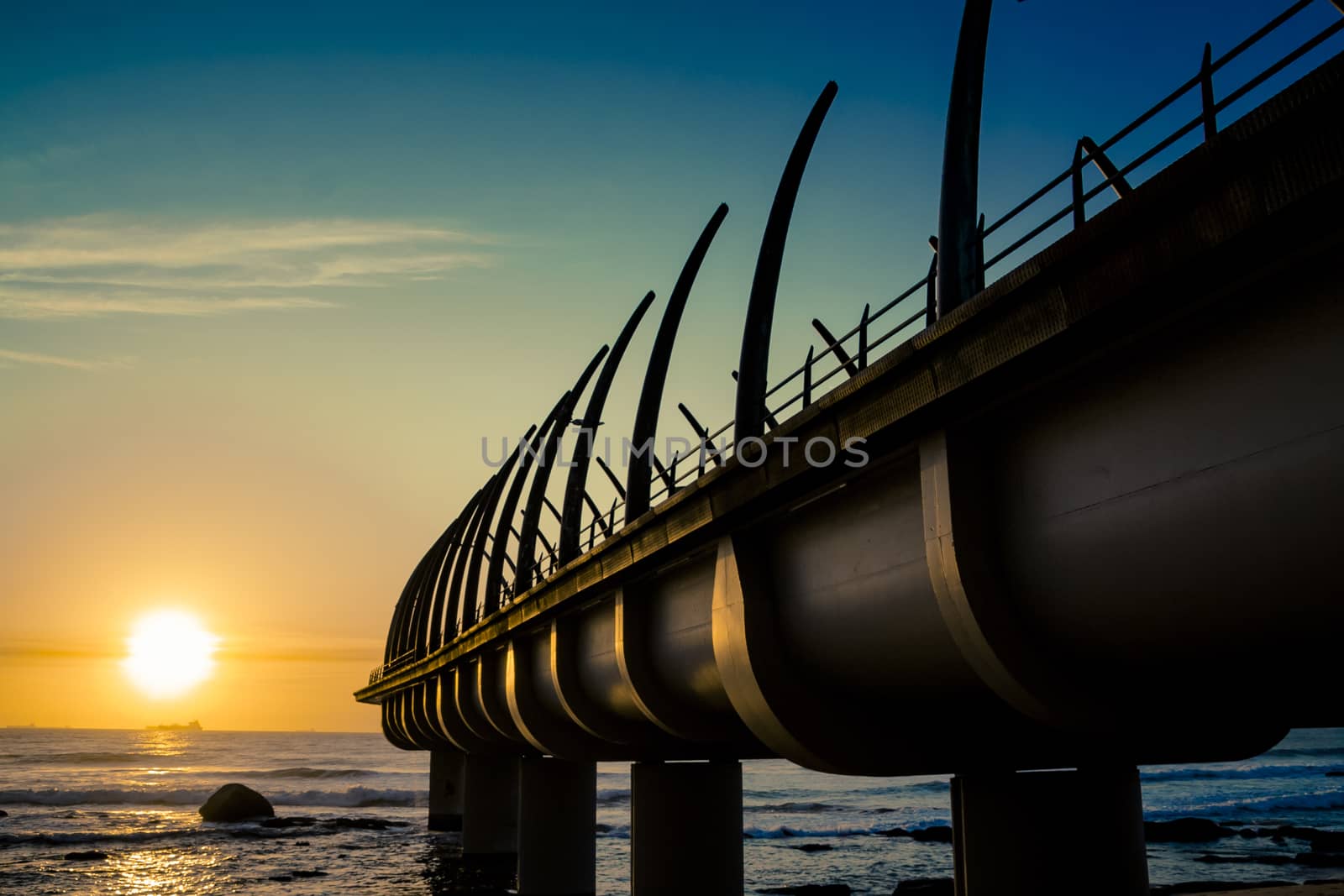 Umhlanga Pier In Durban South Africa with Sunrise over indian ocean 