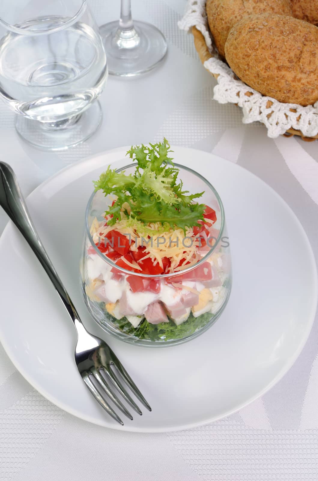 Salad of lettuce with egg, ham, tomatoes, dressed   yogurt and cheese