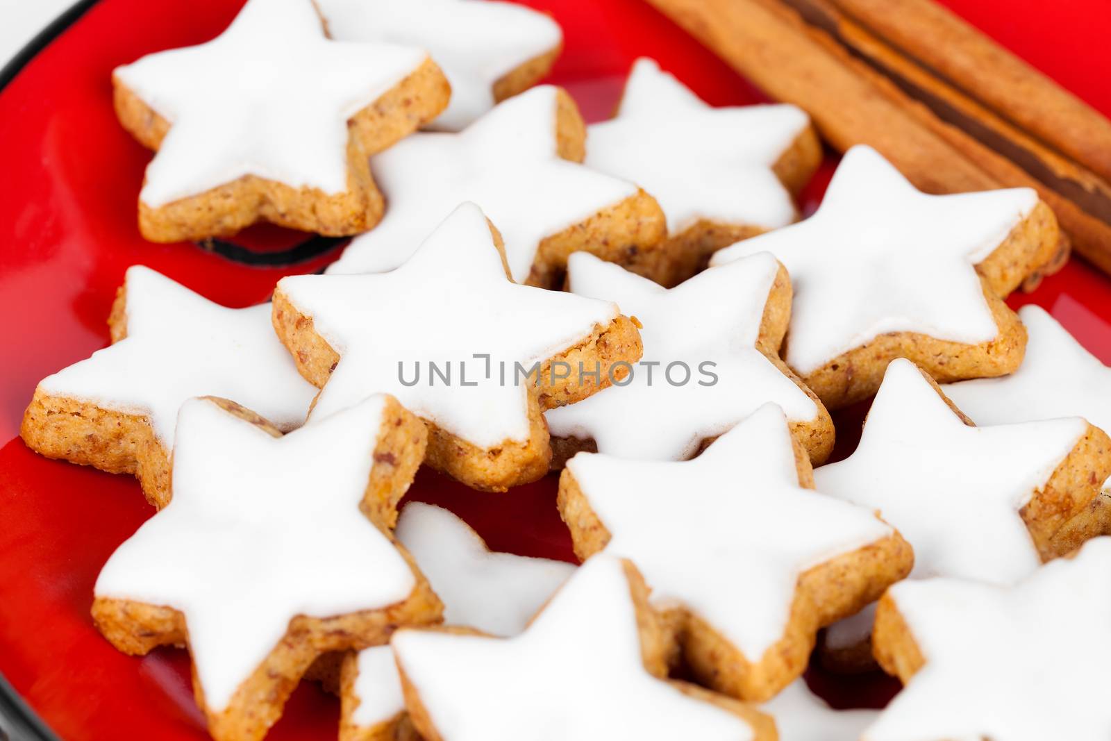 christmas cinnamon star cookies on red plate
