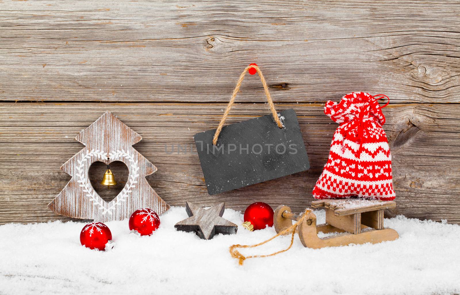 Christmas decoration with xmas canes, over wooden background by motorolka