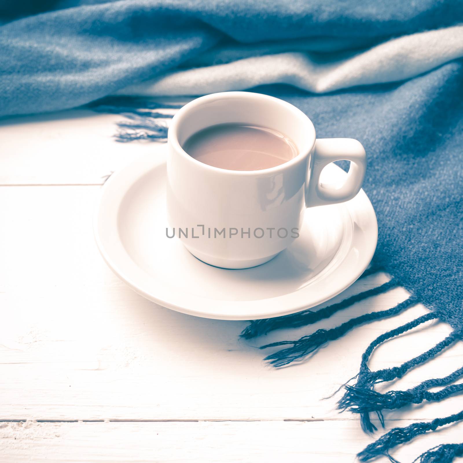 coffee and scarf background on white table vintage style