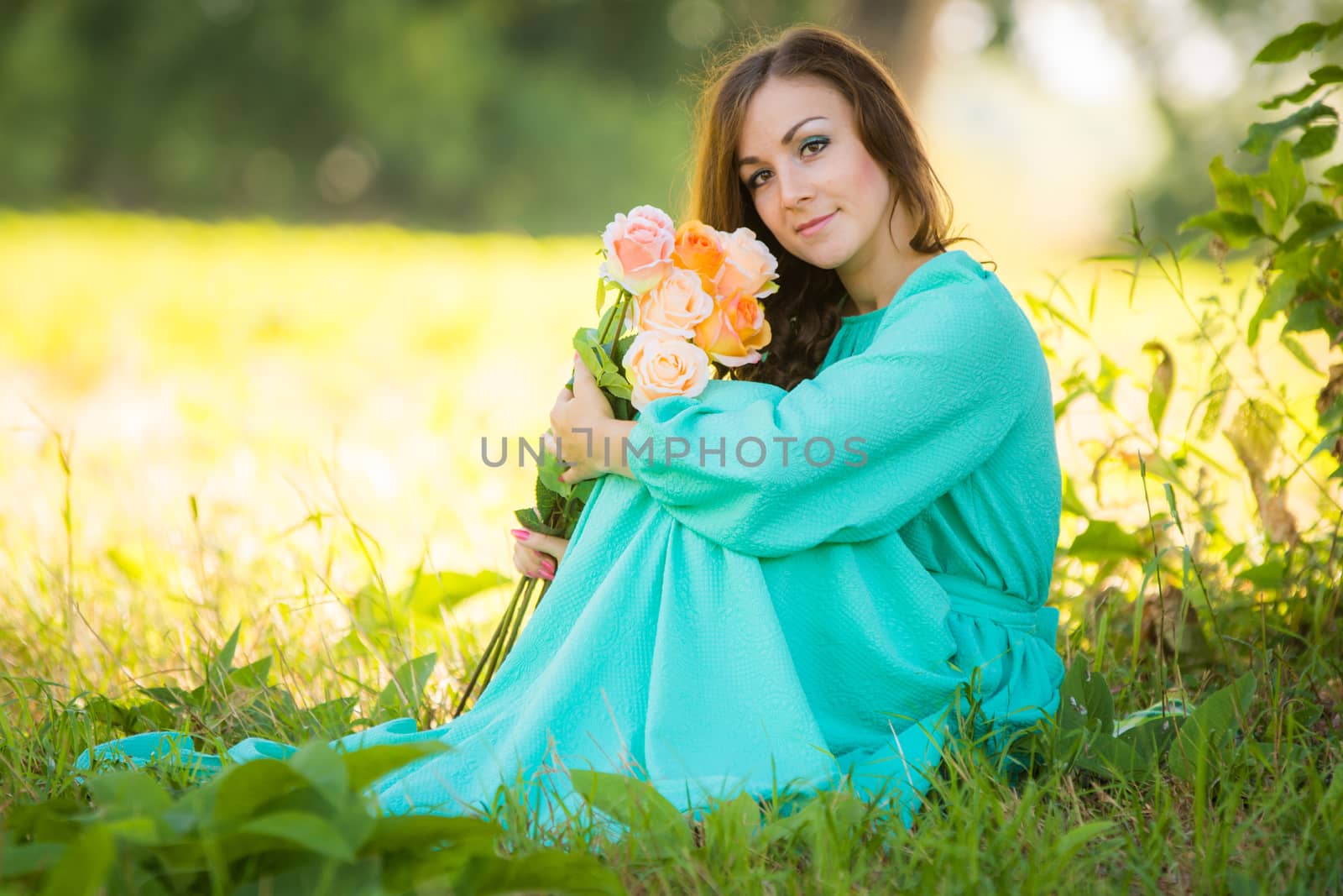 Portrait of a young girl with a bouquet of roses sitting in the shade of the trees on a sunny day by Madhourse