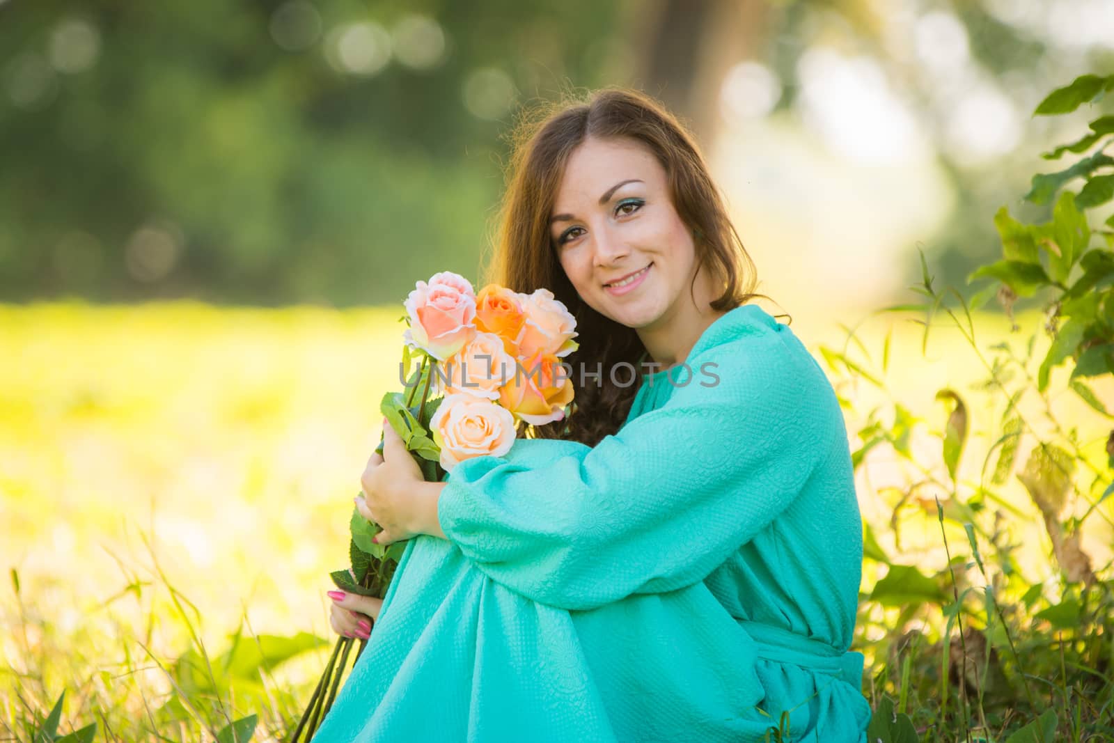 Portrait of a young girl with a bouquet of roses sitting in the shade of the trees on a sunny day by Madhourse