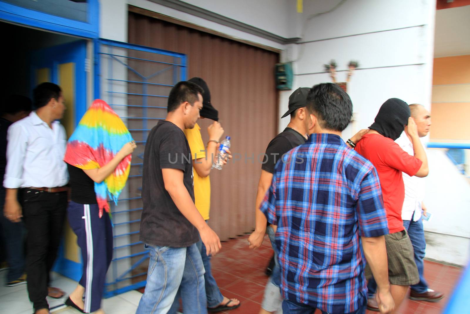 INDONESIA, Medan: Police detectives reveal at a conference that they have busted drug dealers from an international network in the city of Medan, Indonesia on November 3, 2015. A wide array of contraband are on display, reportedly including 12 kg of methamphetamine and 37,000 ecstasy pills, along with scales and weapons. The drugs on display are believed to be of Chinese origin, and the suspect is thought to have been operating in the area for at least six months.