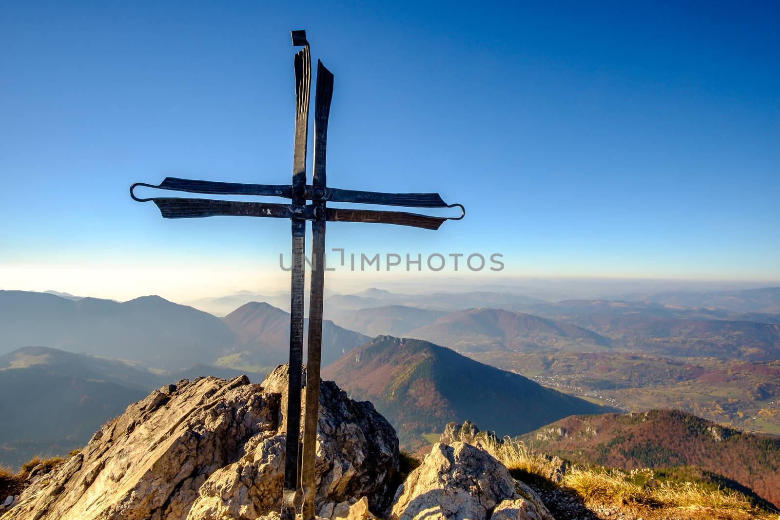 Scenic landscape view of mountain peak Rozsutec with metal cross, Mala Fatra, Slovakia