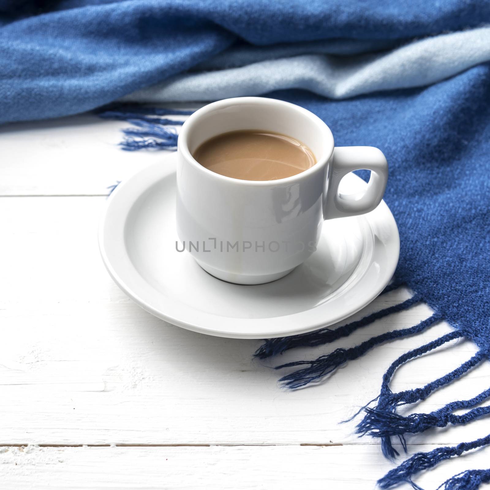 coffee and scarf background on white table