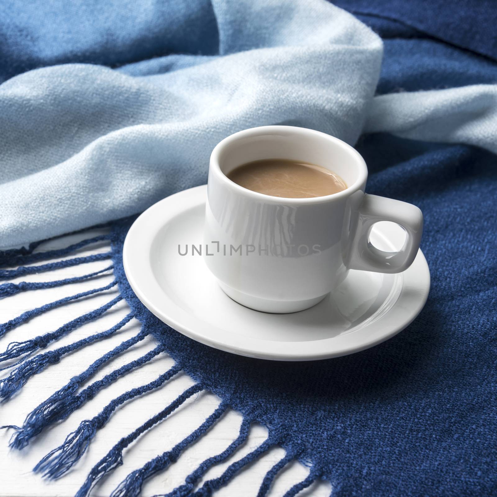 coffee and scarf background on white table