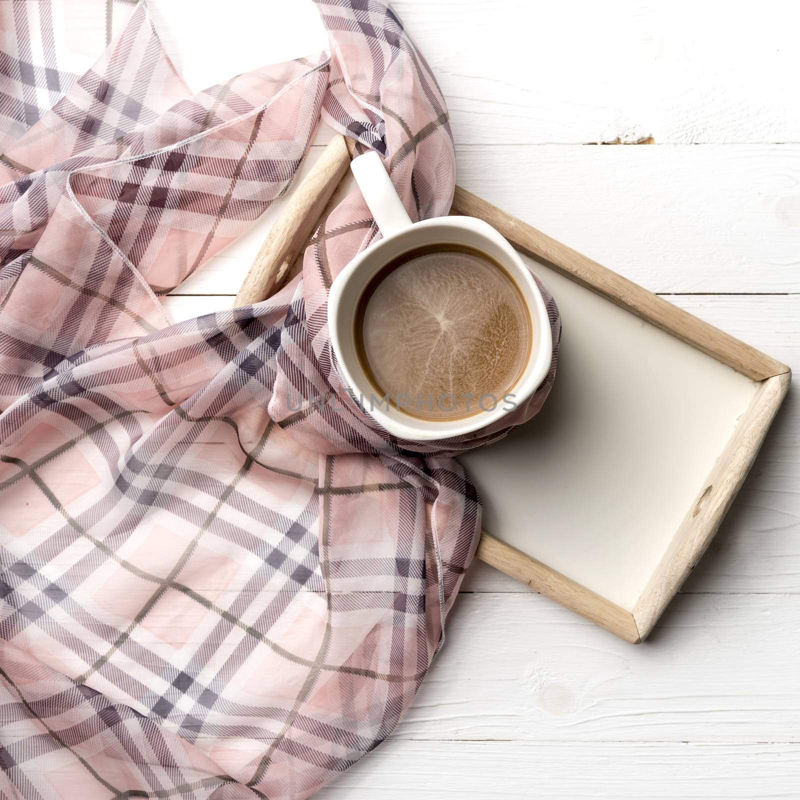 coffee and scarf background on white table