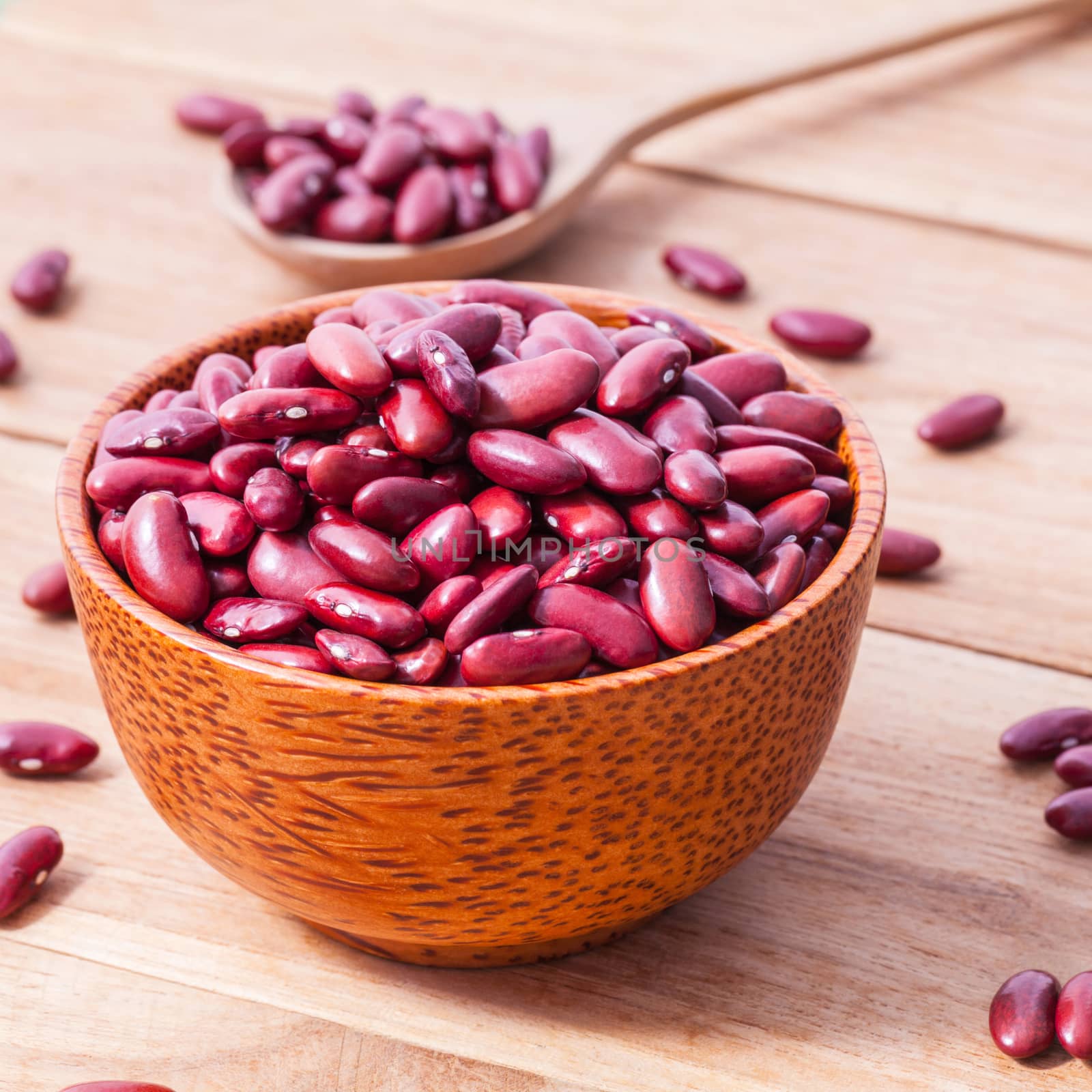Close Up red kidney beans in wooden bowl on wooden background. by kerdkanno