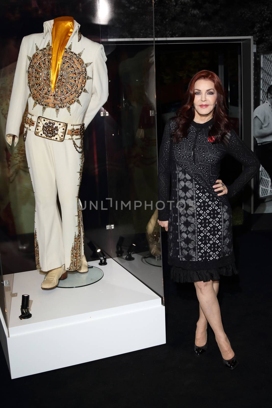 UK, London: Priscilla Presley has showcased Elvis memorabilia at a new exhibition at the 02 Arena in London, on November 3, 2015. The Aztec Sundial Suit worn by the King during his last performance can be seen along with over 300 other artefacts, including cars, guitars and iconic stage costumes. The Elvis at the O2 exhibition chronicles the rise of the rock 'n' roll icon and will be open to the public on December 12, 2015.