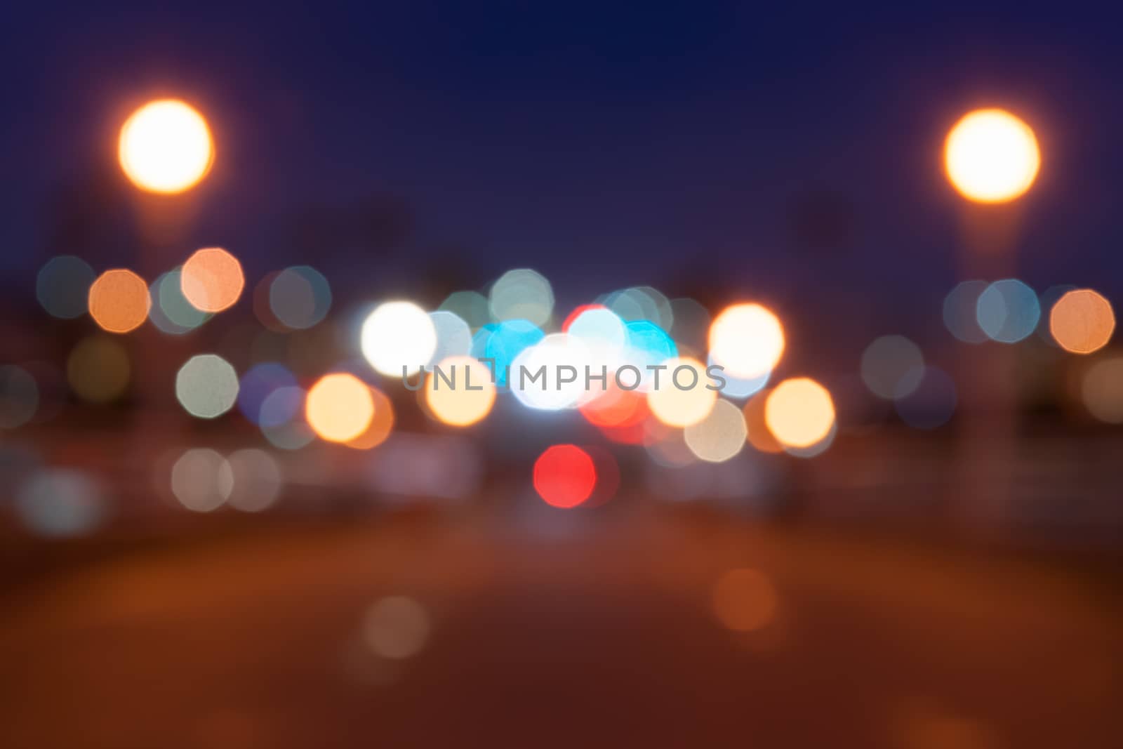 Magical glowing blurred out of focus urban night shot  background street  lights effect.