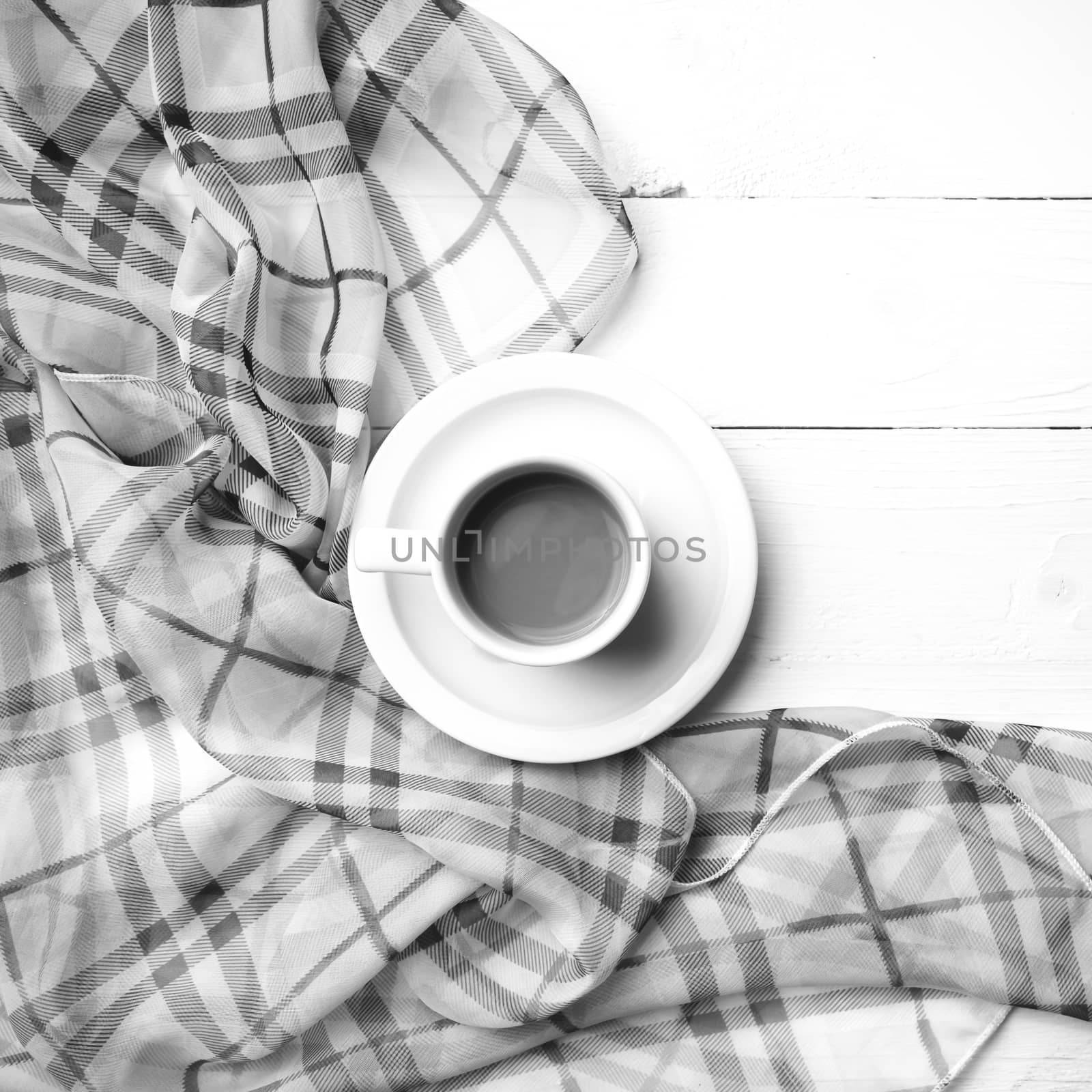 coffee and scarf background on white table black and white color