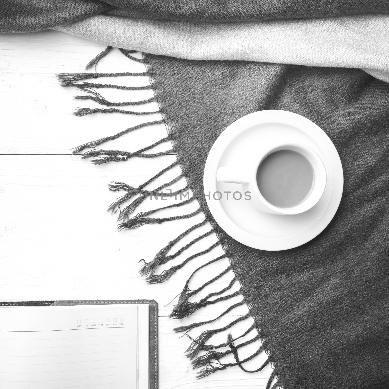 coffee and scarf background on white table black and white color