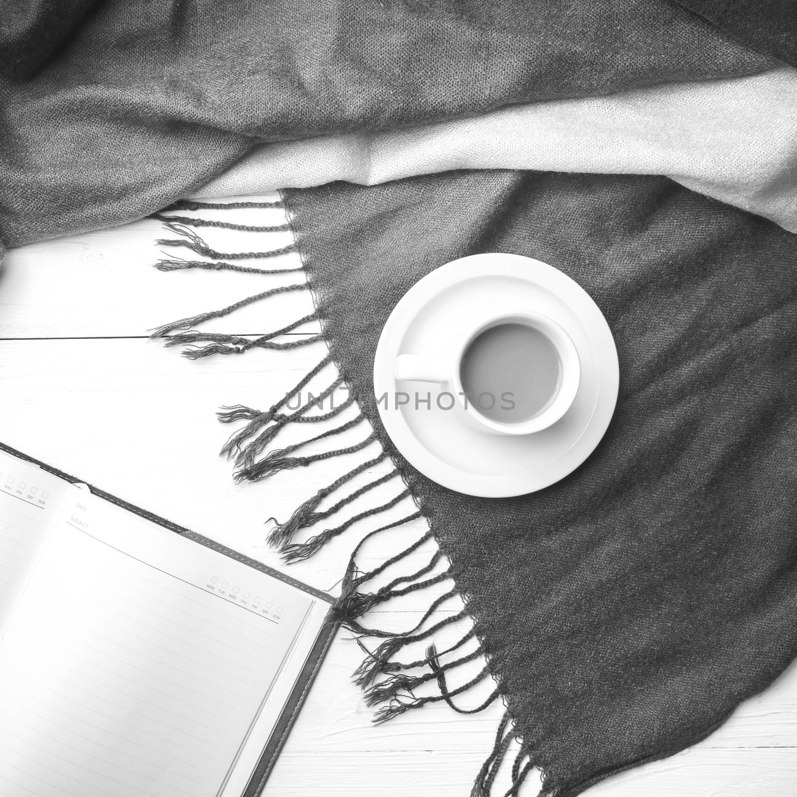 coffee and scarf background on white table black and white color