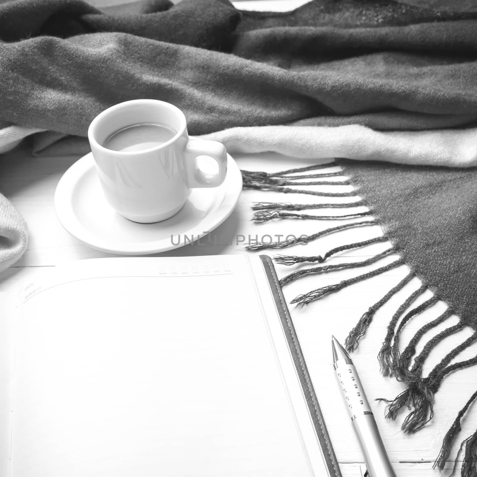 coffee and scarf background on white table black and white color