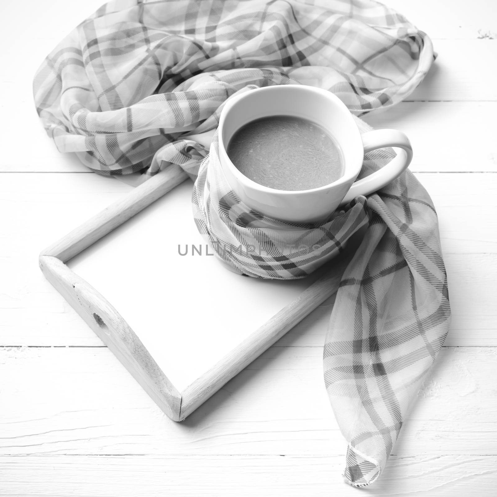 coffee and scarf background on white table black and white color