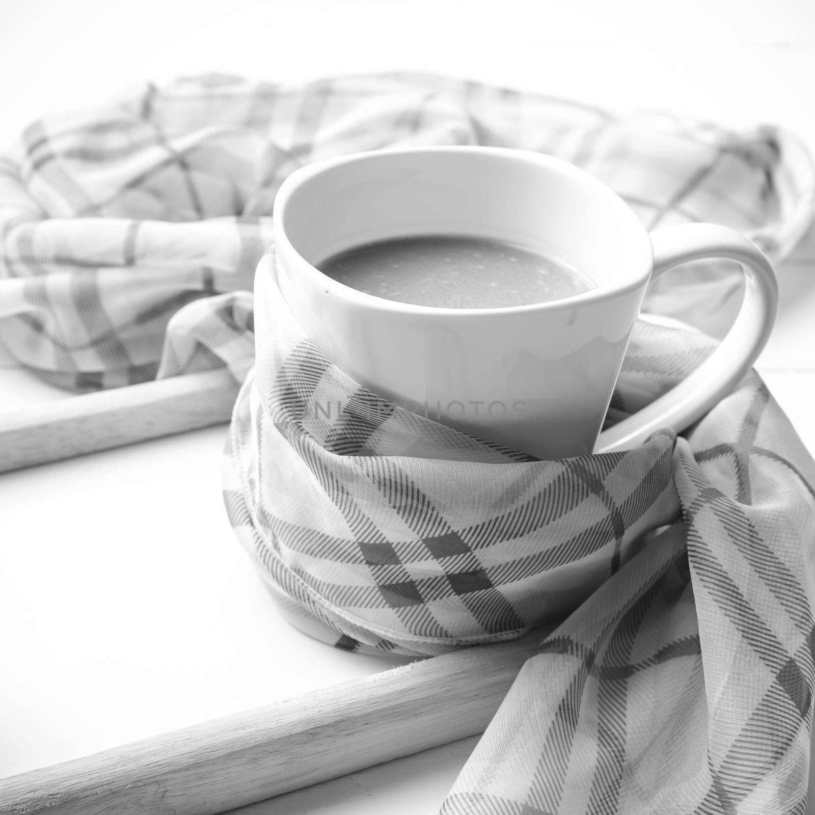 coffee and scarf background on white table black and white color