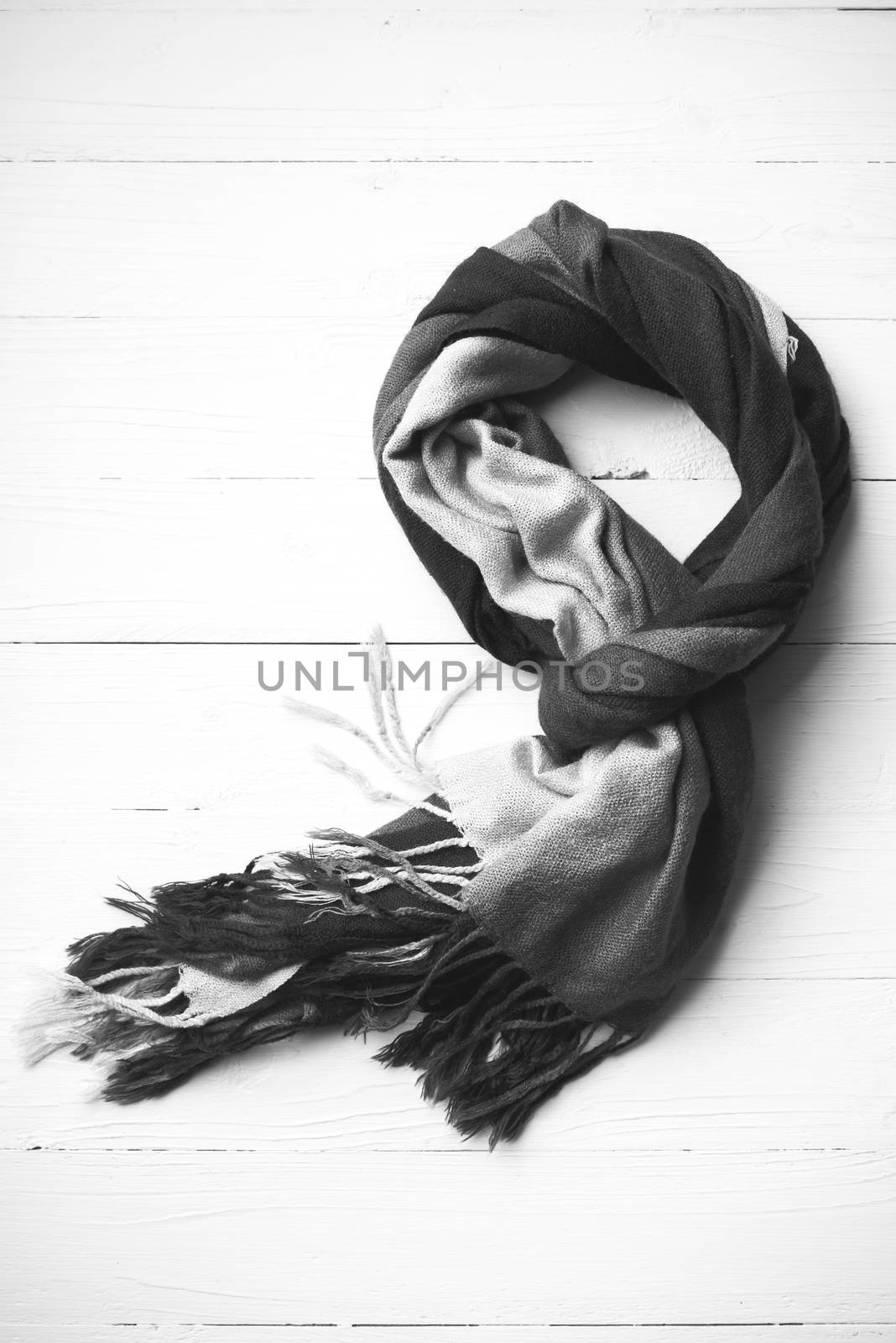 blue scarf over white wood table background black and white color