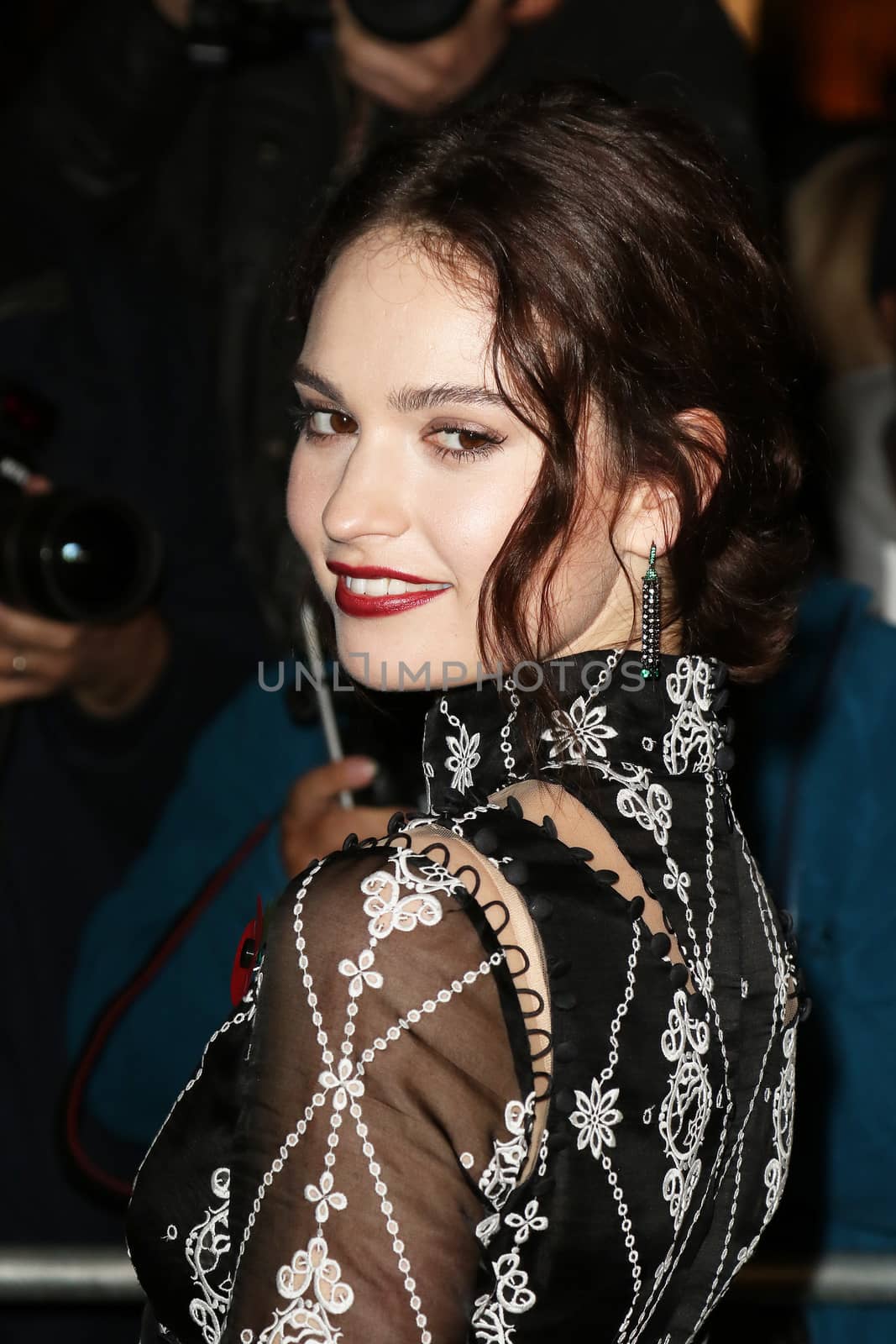 UNITED KINGDOM, London: Lily James poses during the Harper's Bazaar Women of the Year Awards at Claridge's, in London, on November 3, 2015.