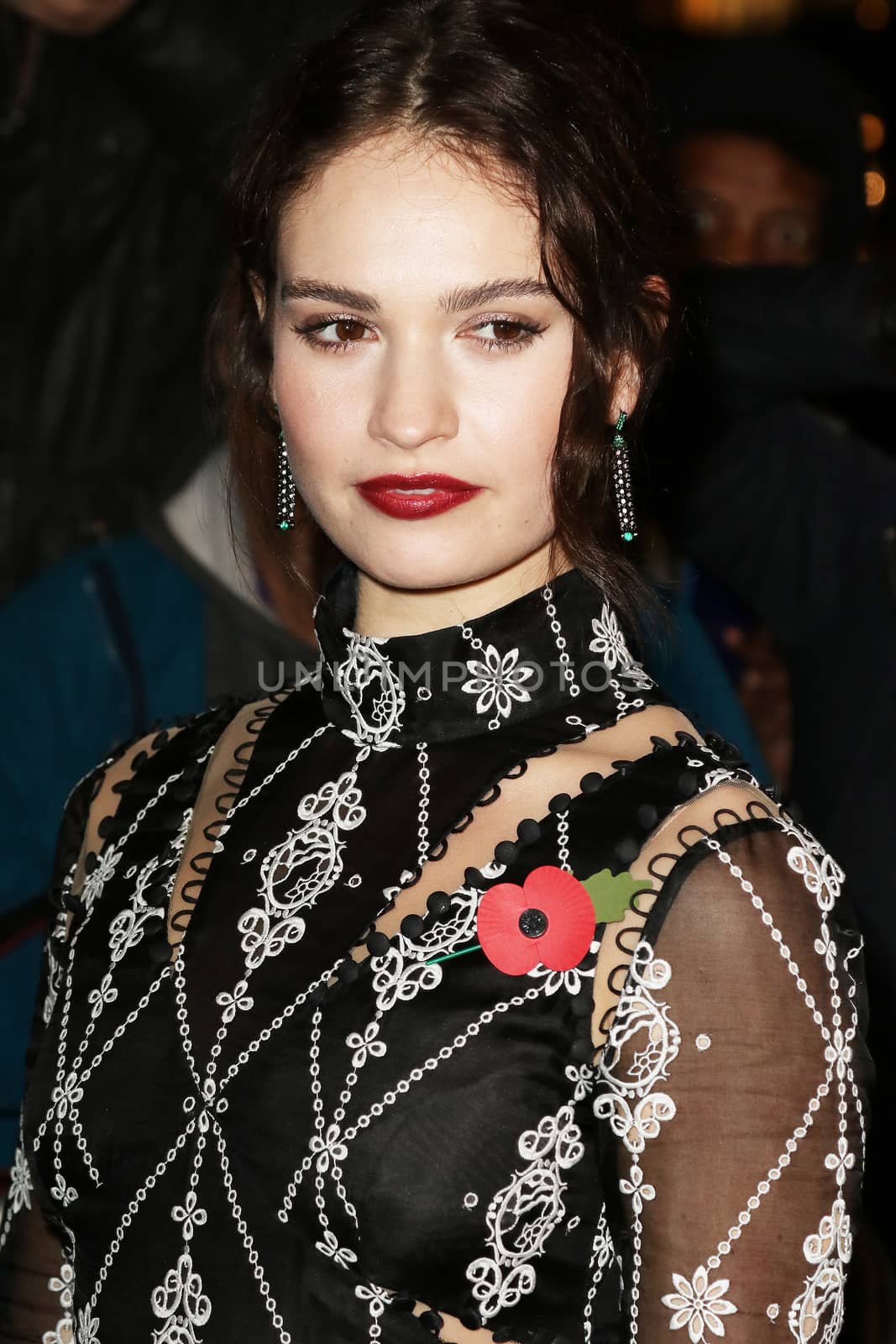 UNITED KINGDOM, London: Lily James poses during the Harper's Bazaar Women of the Year Awards at Claridge's, in London, on November 3, 2015.