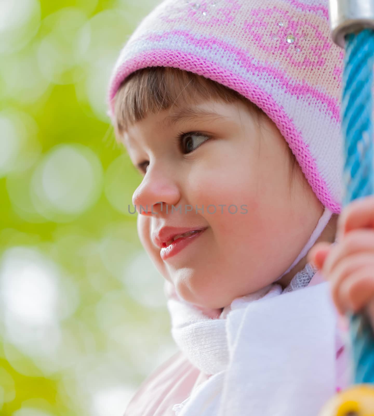 portrait of a little girl playing outdoors in autumn