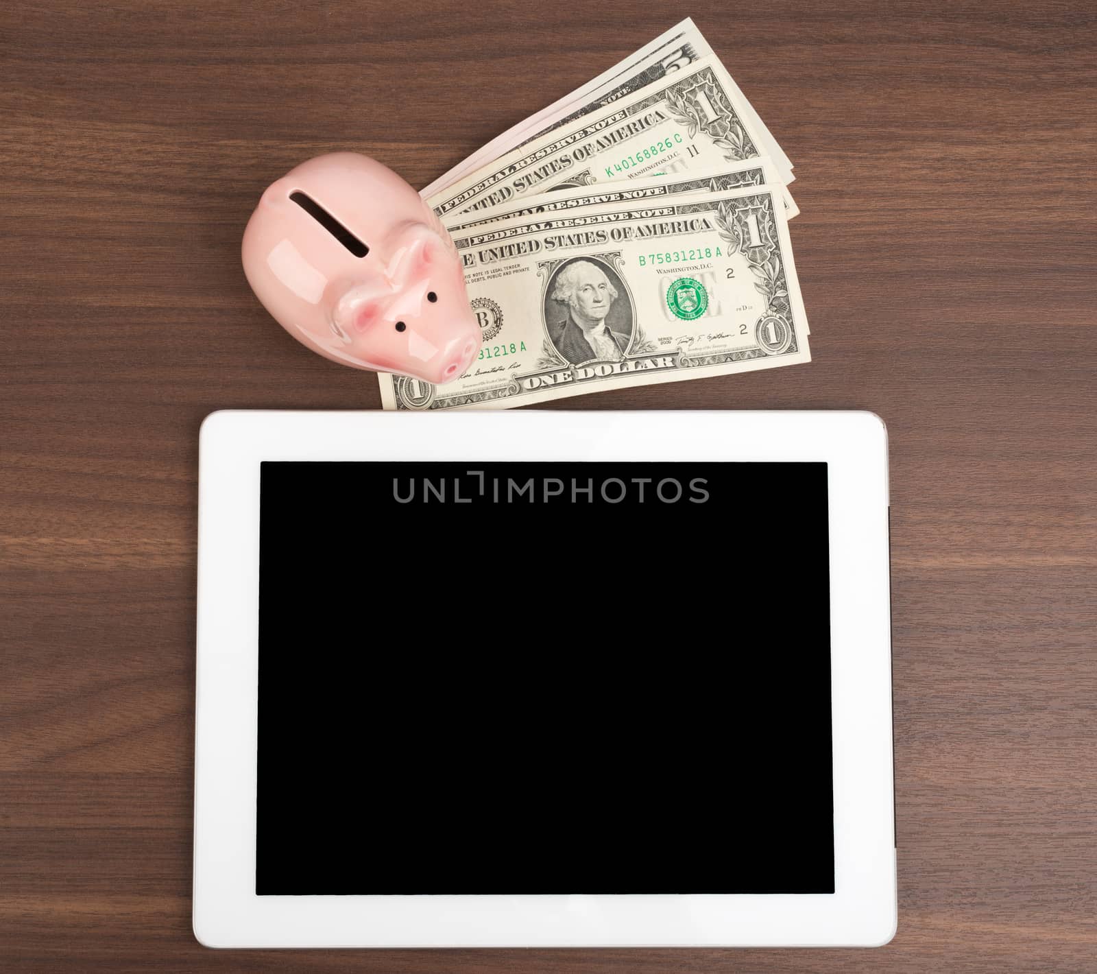 Tablet with piggy bank by cherezoff