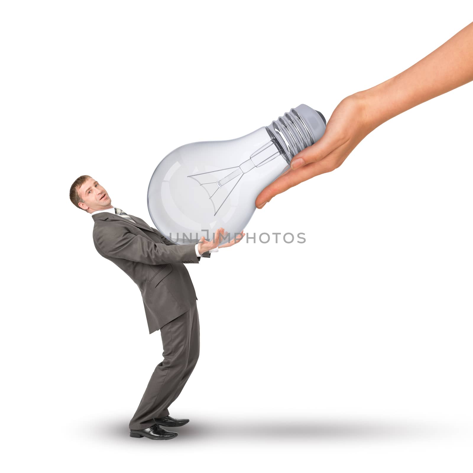 Hand giving bulb to businessman by cherezoff