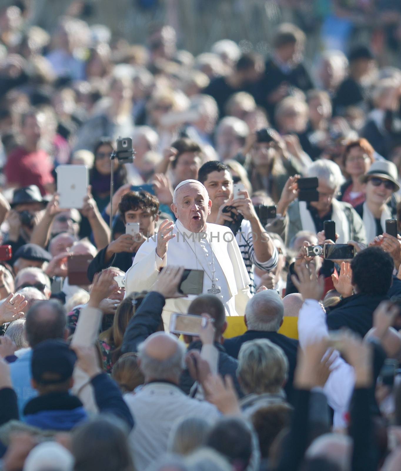 VATICAN: Pope Francis stands among the crowd after his weekly audience in St. Peter's Square at The Vatican on November 4, 2015 in Vatican City, Vatican.