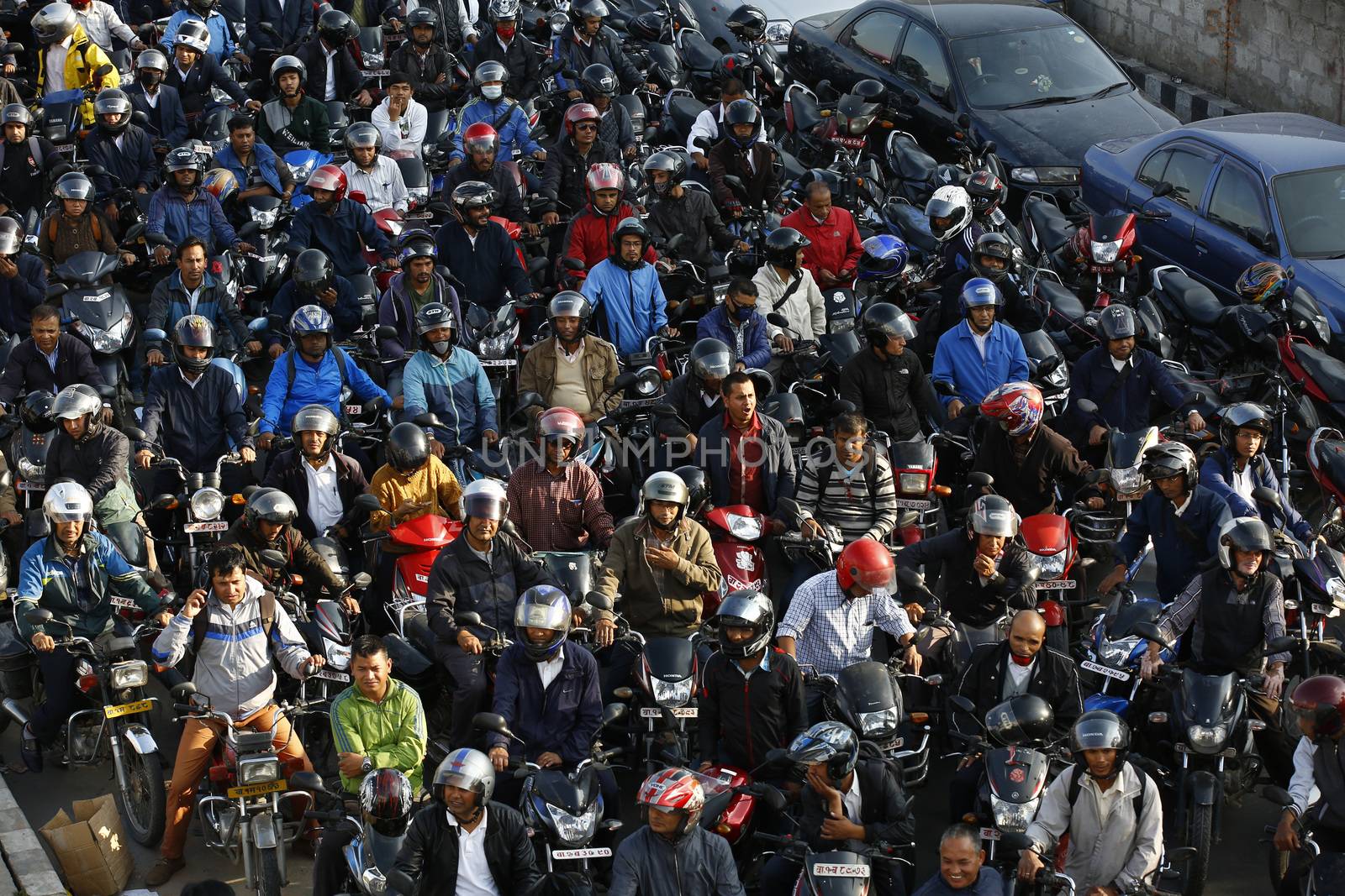 NEPAL, Kathmandu: Motorists wait in a queue for petrol near a petrol station in Kathmandu on November 4, 2015. Nepal signed a deal last week with China to import petroleum products, its embassy in Beijing said, as the Himalayan nation tries to boost supplies to deal with a deepening fuel crisis. The curfew imposed in Birgunj, Nepal after violent protests where one person was killed near the Shankaracharya Gate close to the Nepal-India border on Monday causing tight security for goods to arrive.