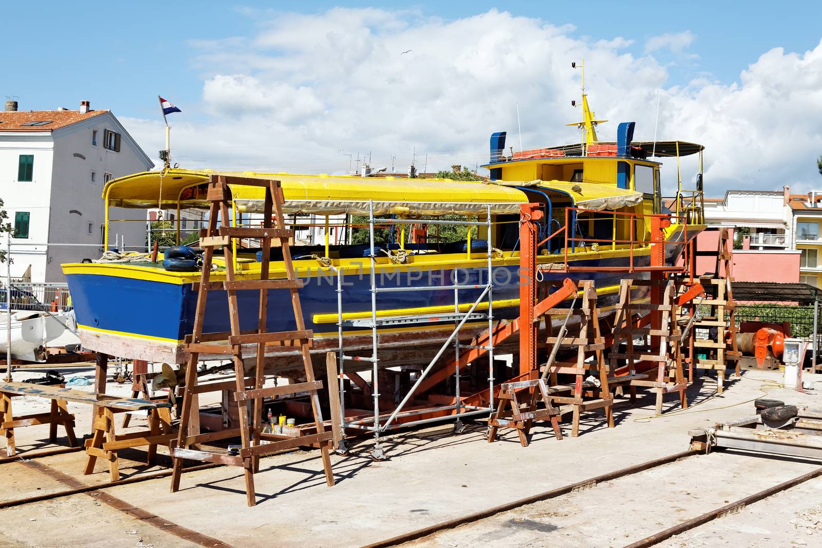 old passenger boat under repair in dry dock