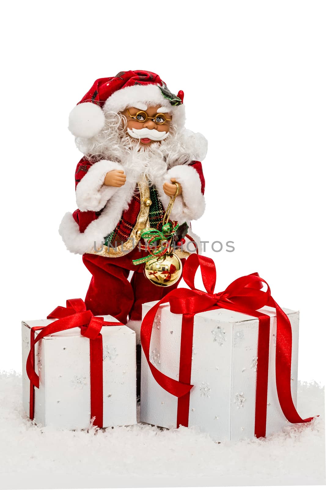 Santa Claus on snow with gift boxes - toy, isolated on white background
