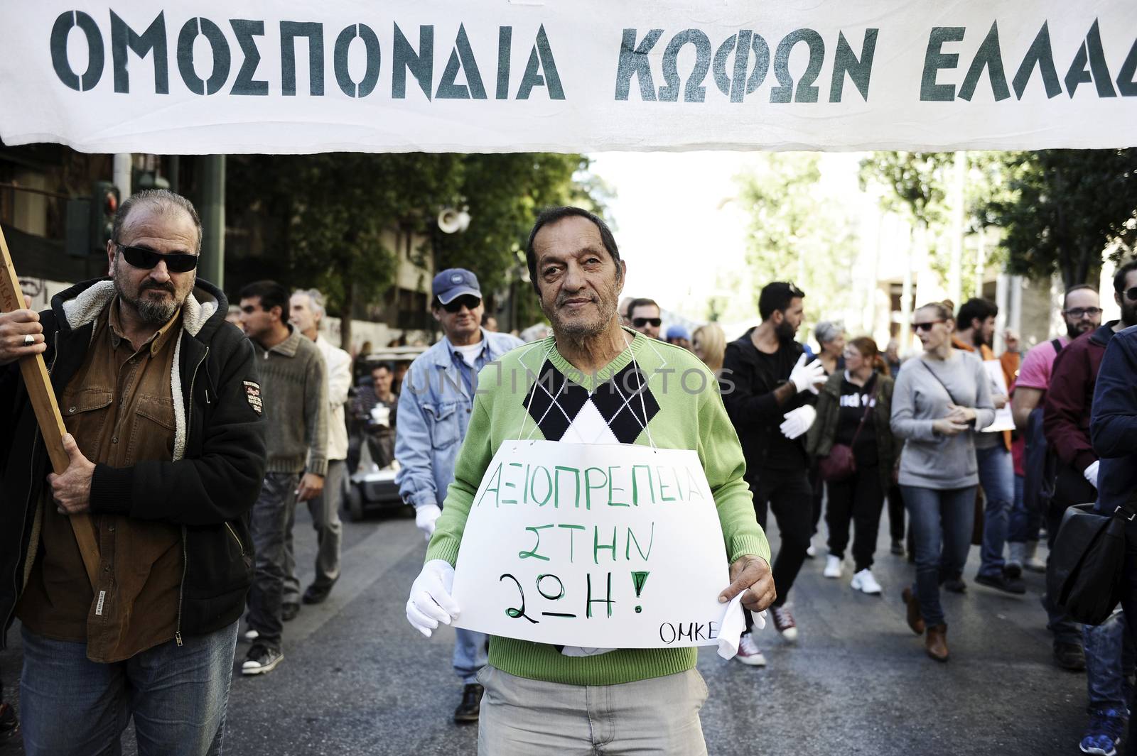 GREECE, Athens: Disabled persons take part in a protest in Athens on November 4, 2015 to condemn the new planned cuts to their pensions and allowances. These cuts form part of the requirements of the country's creditors.