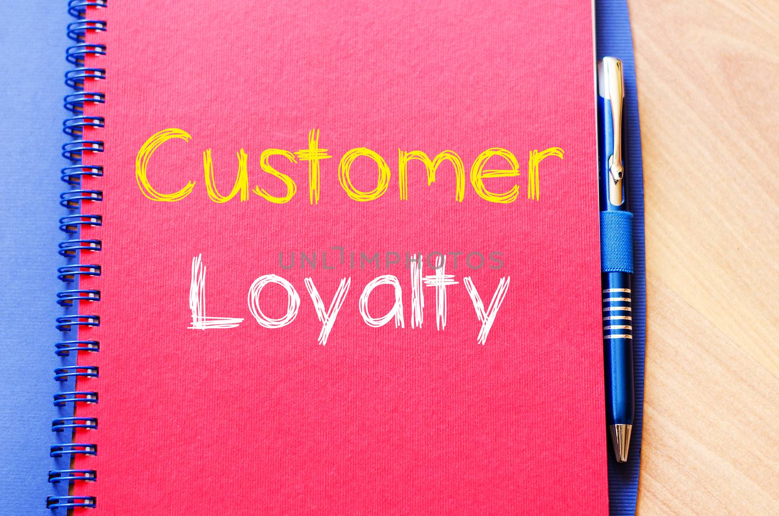 Customer loyalty text concept write on notebook